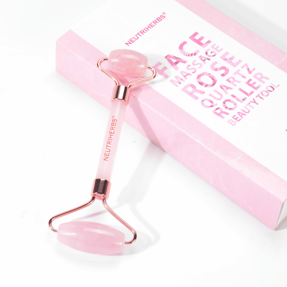 Neutriherbs facial roller in pink quartz for facial massage and skincare routine.