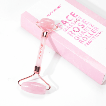 Neutriherbs facial roller in pink quartz for facial massage and skincare routine.