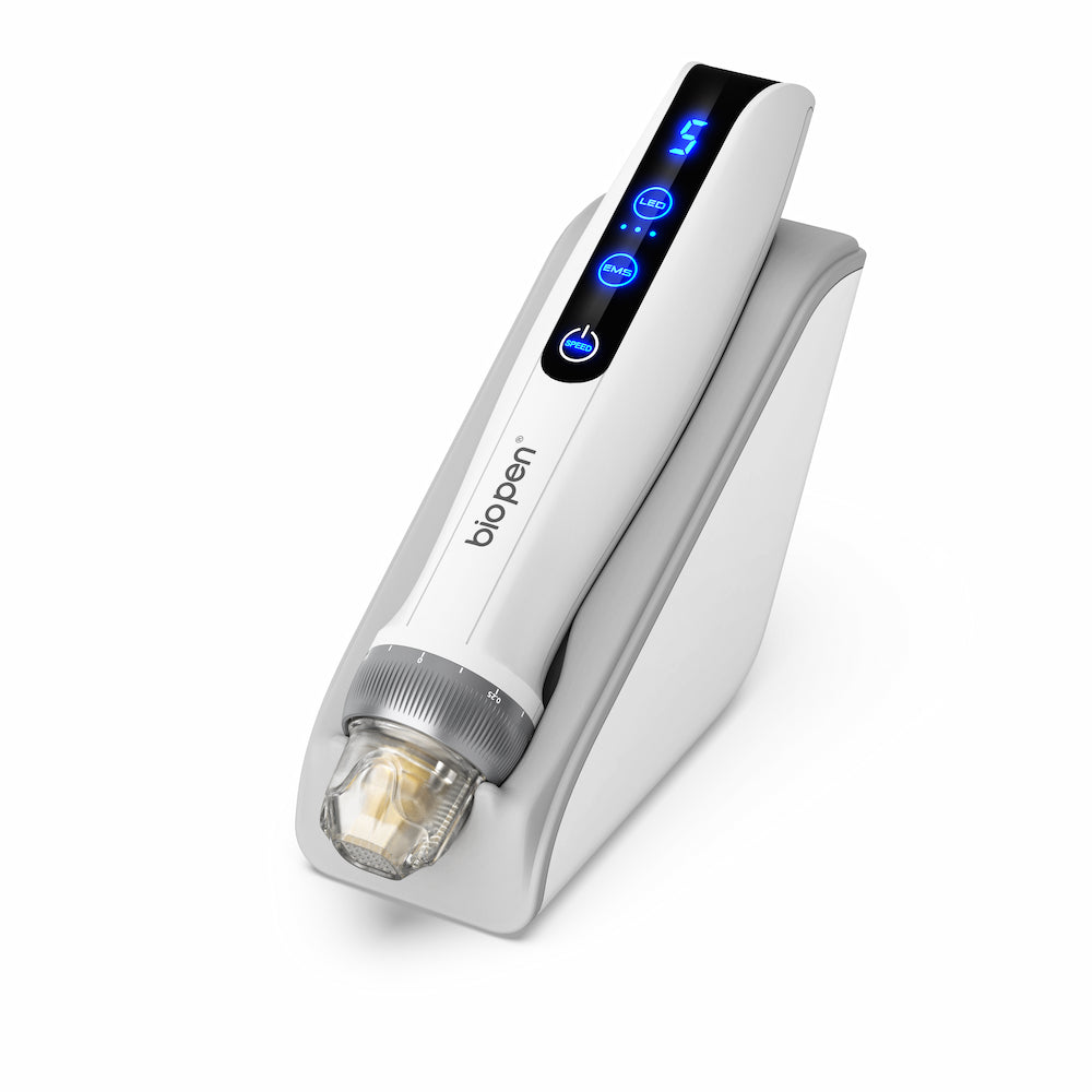White BioPen Q2 microneedling pen placed in a white stand, with blue digital LED display and transparent needle module.