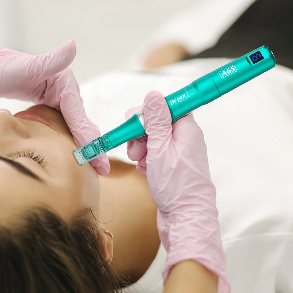 Professional microneedling with Dr. Pen A6S where a person in gloves performs a facial treatment on a customer lying relaxed.
