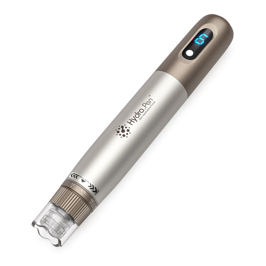 HydraPen H3 microneedling-pen in gold and silver with digital speed display and needle module at the front.