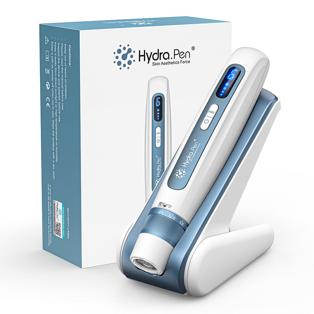 HydraPen H5 microneedling pen in white and blue design placed in its charging stand next to the original packaging, for professional skincare and serum infusion.