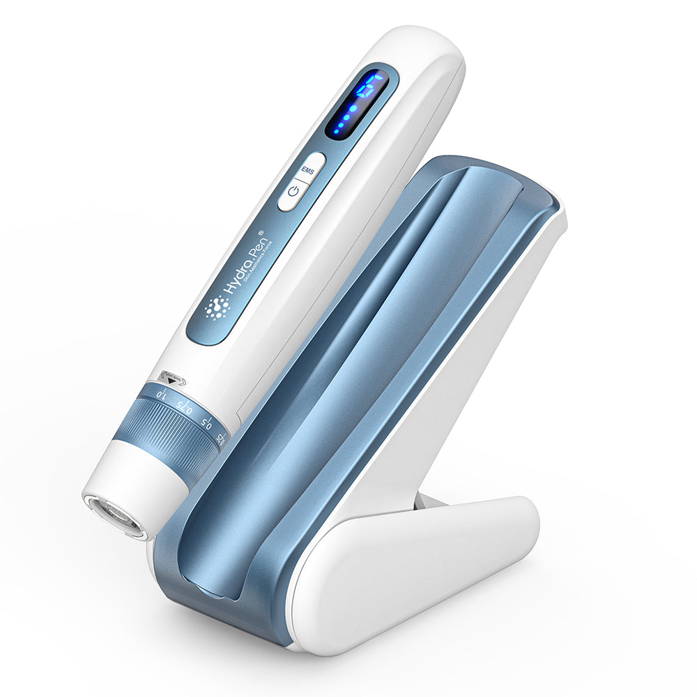HydraPen H5 white and blue microneedling pen placed in its charging stand, advanced microneedling device for effective serum infusion and skin rejuvenation.