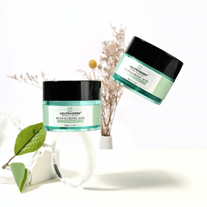 Lifestyle image of Neutriherbs 4D Hyaluronic Acid Gel Moisturizer 50 g. Two jars of the hydrating gel cream are presented in a bright and stylish setting with natural details that convey a fresh skincare routine and intense hydration.