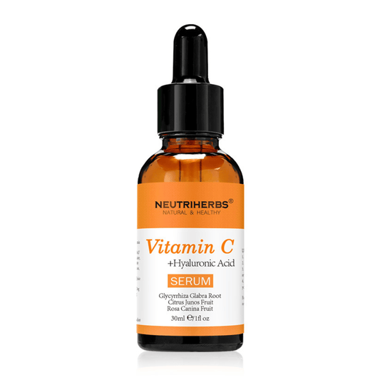 Neutriherbs Vitamin C + Hyaluronic Acid Serum 30 ml against a white background. Facial serum with vitamin C and hyaluronic acid that hydrates the skin, boosts radiance, and contributes to a more even skin tone.