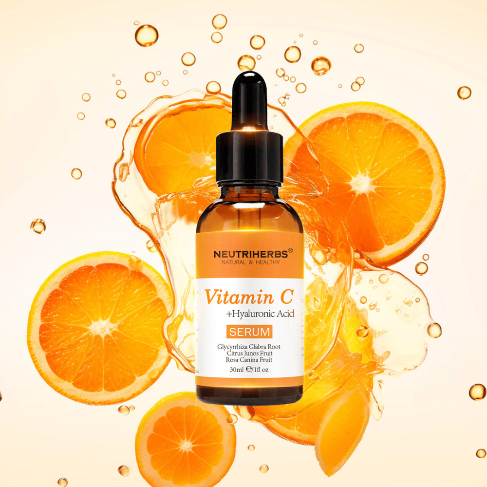 Neutriherbs Vitamin C + Hyaluronic Acid Serum 30 ml with orange slices and splashes of citrus juice. Product image highlighting the serum’s content of vitamin C and hyaluronic acid for intense hydration, enhanced radiance, and a more even skin tone.