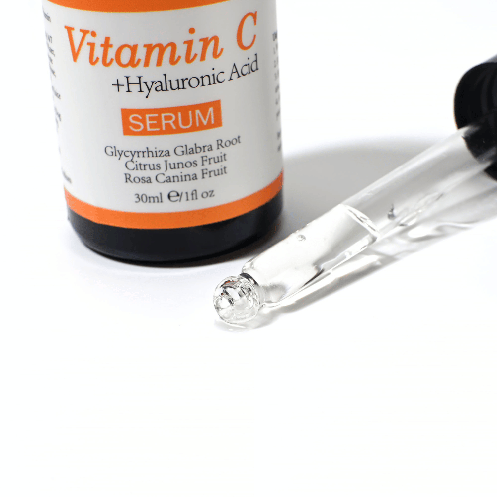Close-up of a dropper and bottle of Neutriherbs Vitamin C + Hyaluronic Acid Serum 30 ml. The lightweight serum texture absorbs quickly and hydrates the skin while contributing to enhanced radiance and a more even skin tone.